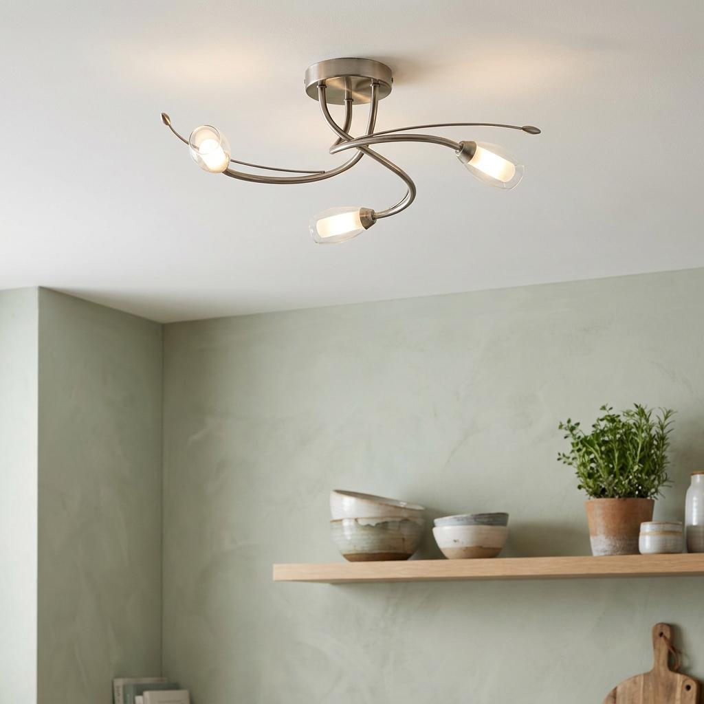 Pandora 3-light antique chrome flush ceiling light with curved arms and clear glass shades in a modern interior.