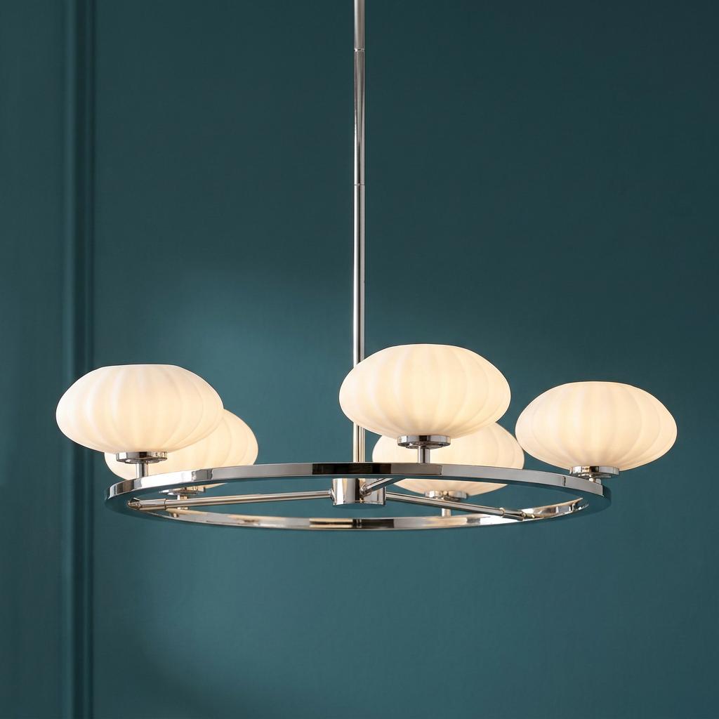 Pim 5 light polished chrome chandelier with white ribbed glass shades against a teal wall.