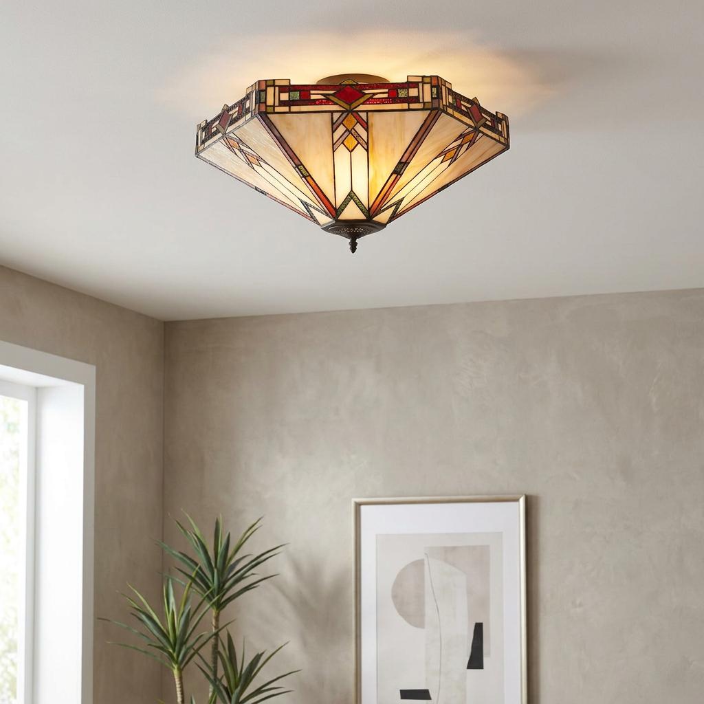 Prairie style flush Tiffany ceiling light with geometric patterns in a modern living room setting.