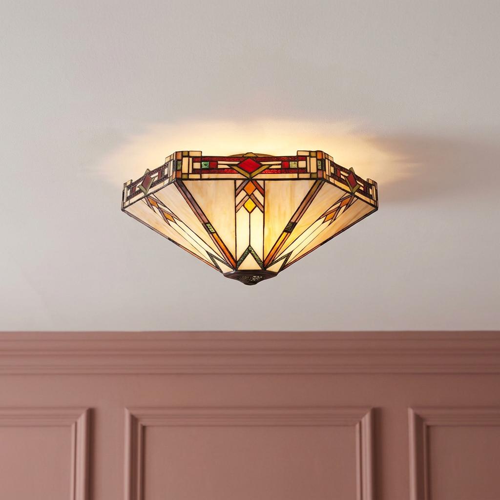 Prairie style Tiffany flush mount ceiling light with geometric art glass shade on a white ceiling.