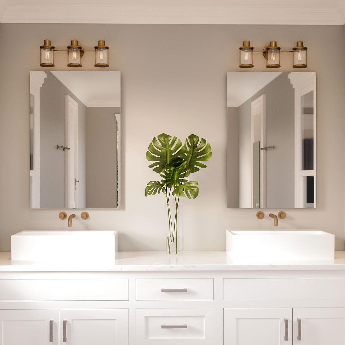 Quoizel Riggs 3 Light Brass Bathroom Wall Light