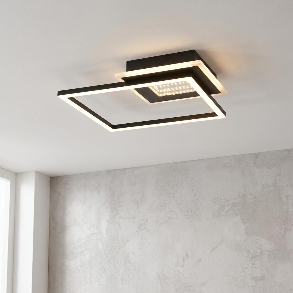 Minimalist matt black LED flush ceiling light featuring two overlapping illuminated square frames.