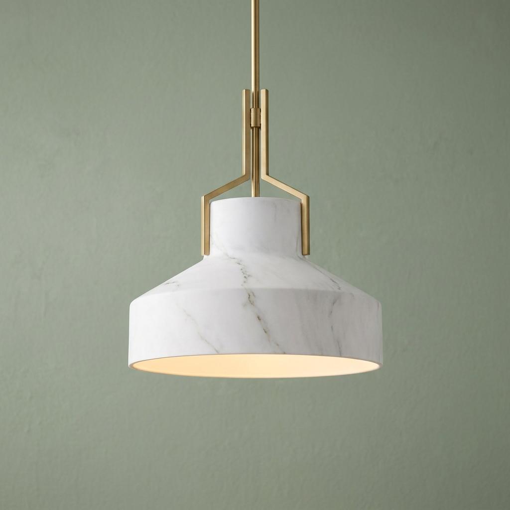 Quoizel Brecken pendant light with faux alabaster shade and aged brass fixture against a muted green wall.