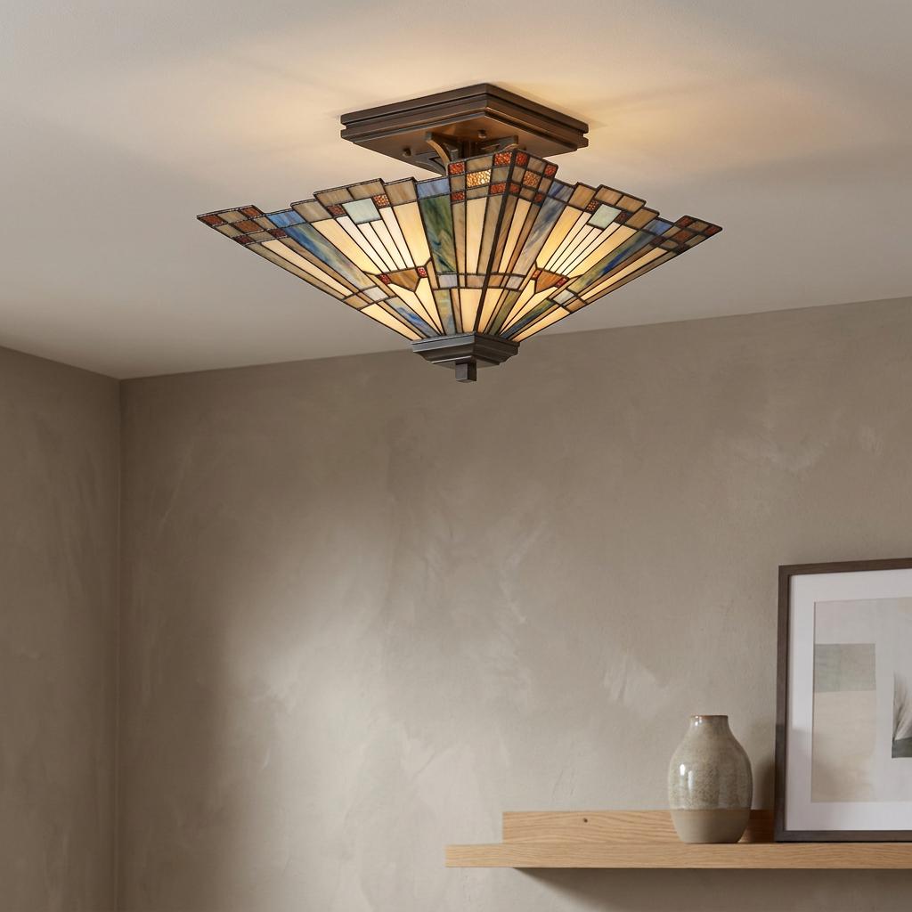 Quoizel Inglenook Tiffany ceiling light with a geometric patterned glass shade mounted on a white ceiling.