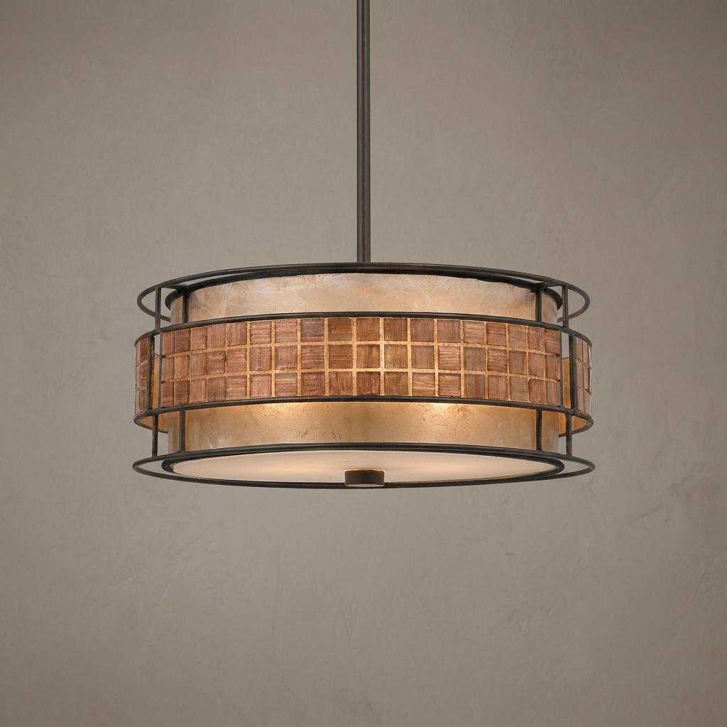 Drum-shaped pendant ceiling light with a copper mosaic band and dark metal cage.