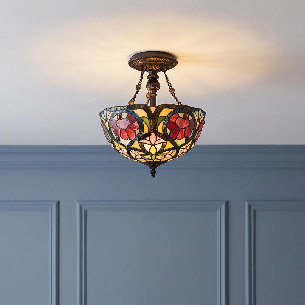 Quoizel Larissa semi-flush Tiffany ceiling light with a floral stained glass shade against a blue paneled wall.