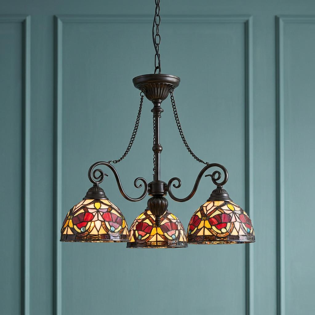 Quoizel Larissa 3-light chandelier with vibrant Tiffany-style glass shades set against a teal paneled wall.