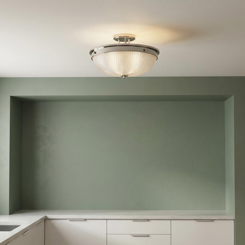 Quoizel Mantle semi-flush ceiling light in polished nickel with ribbed glass above a kitchen counter.