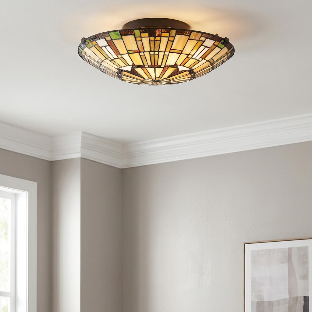 Quoizel Reed Tiffany flush mount ceiling light with a geometric stained glass shade in amber and cream tones.