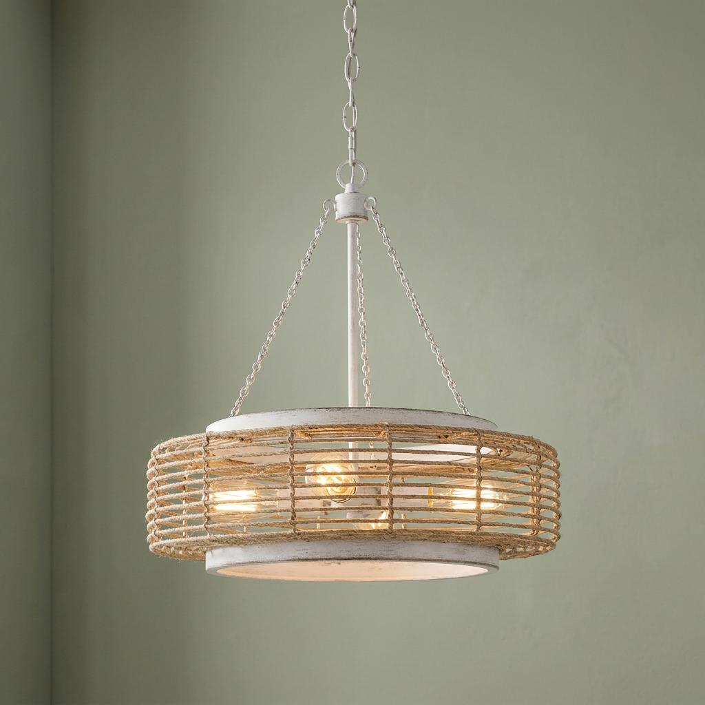 Rustic white pendant light featuring a rope-wrapped drum shade and glowing bulbs against a sage green wall.