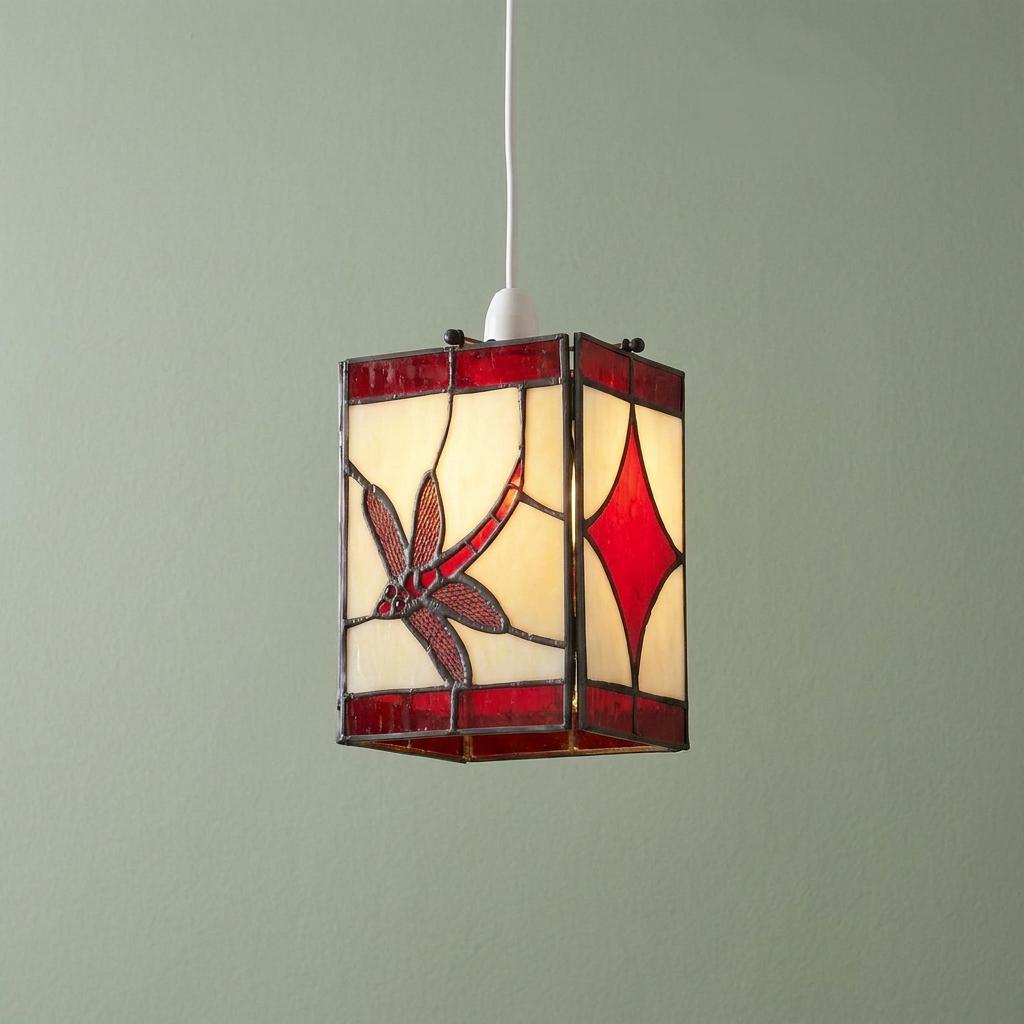 Rectangular Tiffany ceiling lamp shade with a red dragonfly design hanging against a pale green wall.