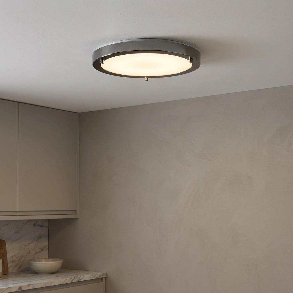 Large Rondo flush bathroom ceiling light with a black mirror finish mounted on a white ceiling.