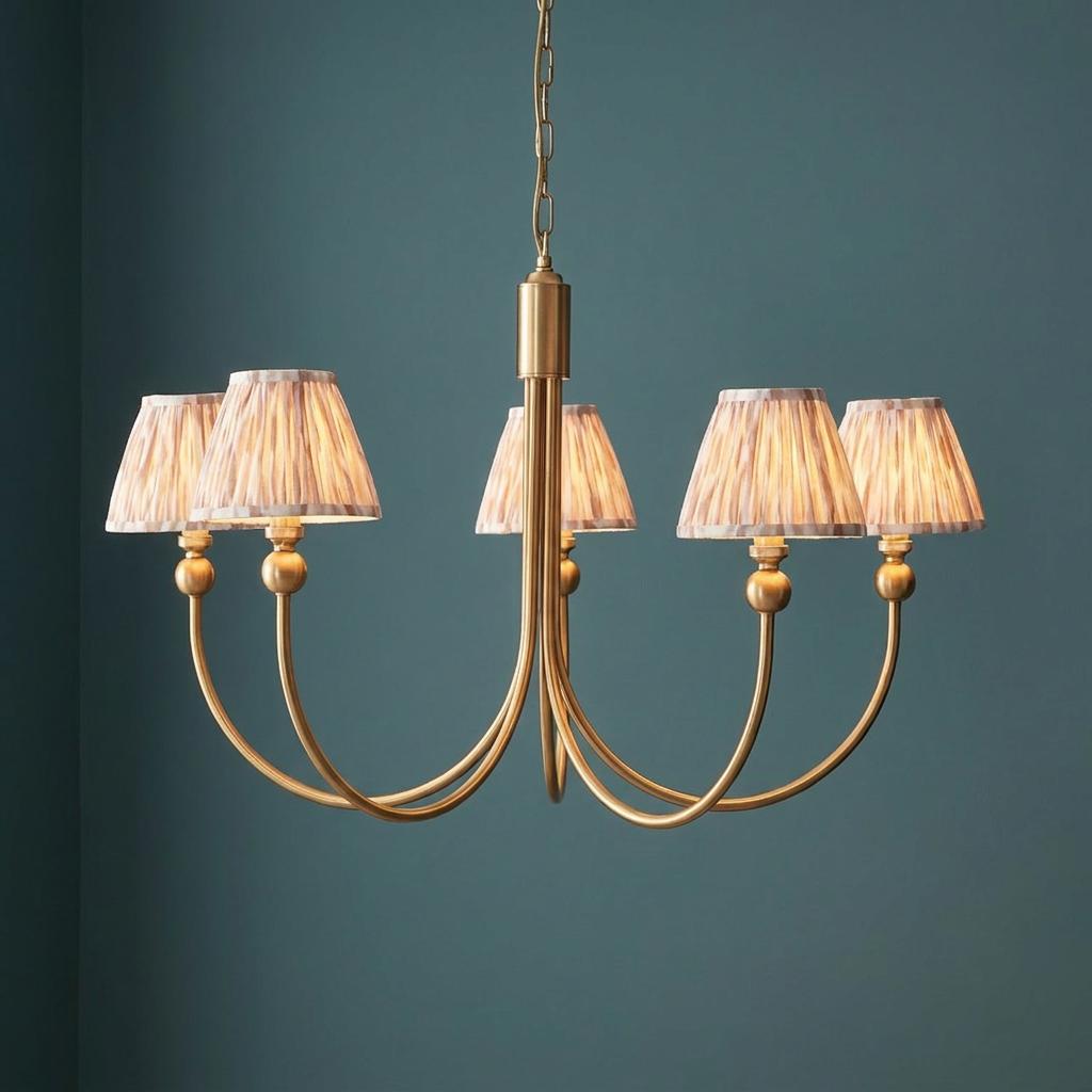 Santiago brass chandelier with five arms and neutral ikat patterned shades against a teal wall.