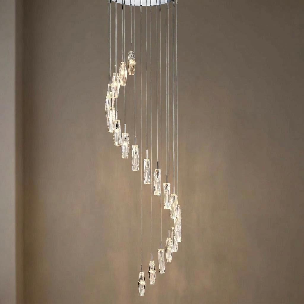 Spiral multi-drop pendant featuring twenty glowing K9 glass ice cylinders on thin chrome cables.