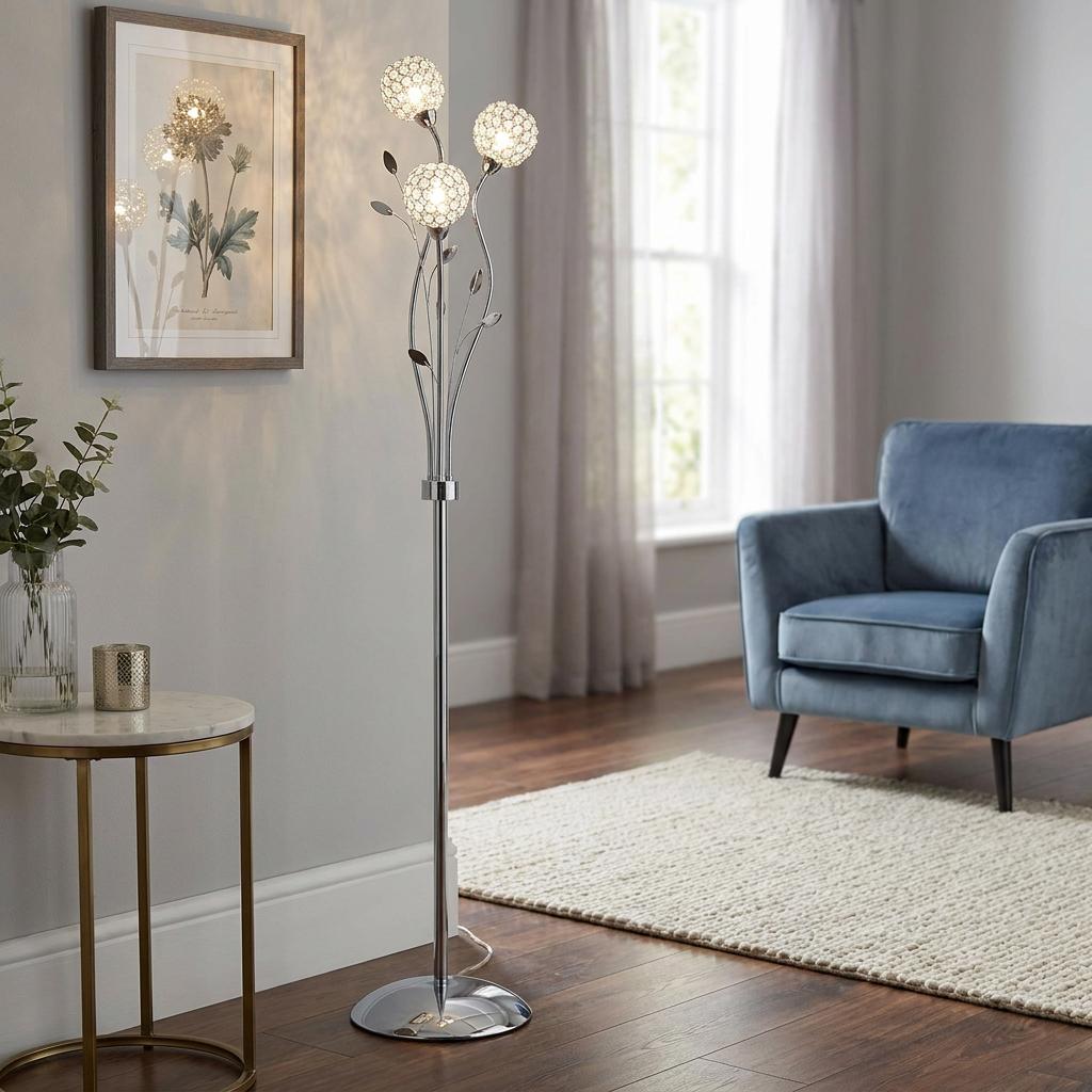 Searchlight Bellis II chrome floor lamp with three crystal globes and decorative leaves in a modern living room.
