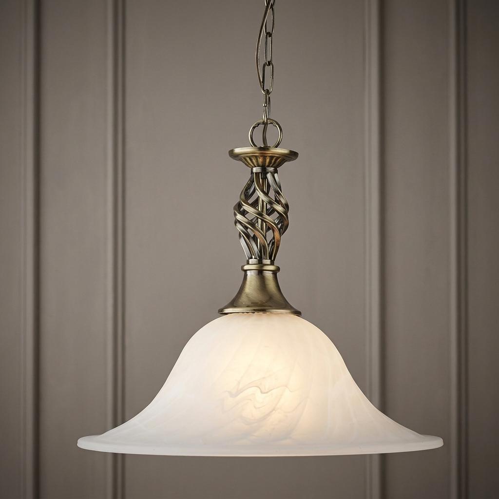 Traditional antique brass pendant light with a twisted stem and a frosted white glass bell shade.