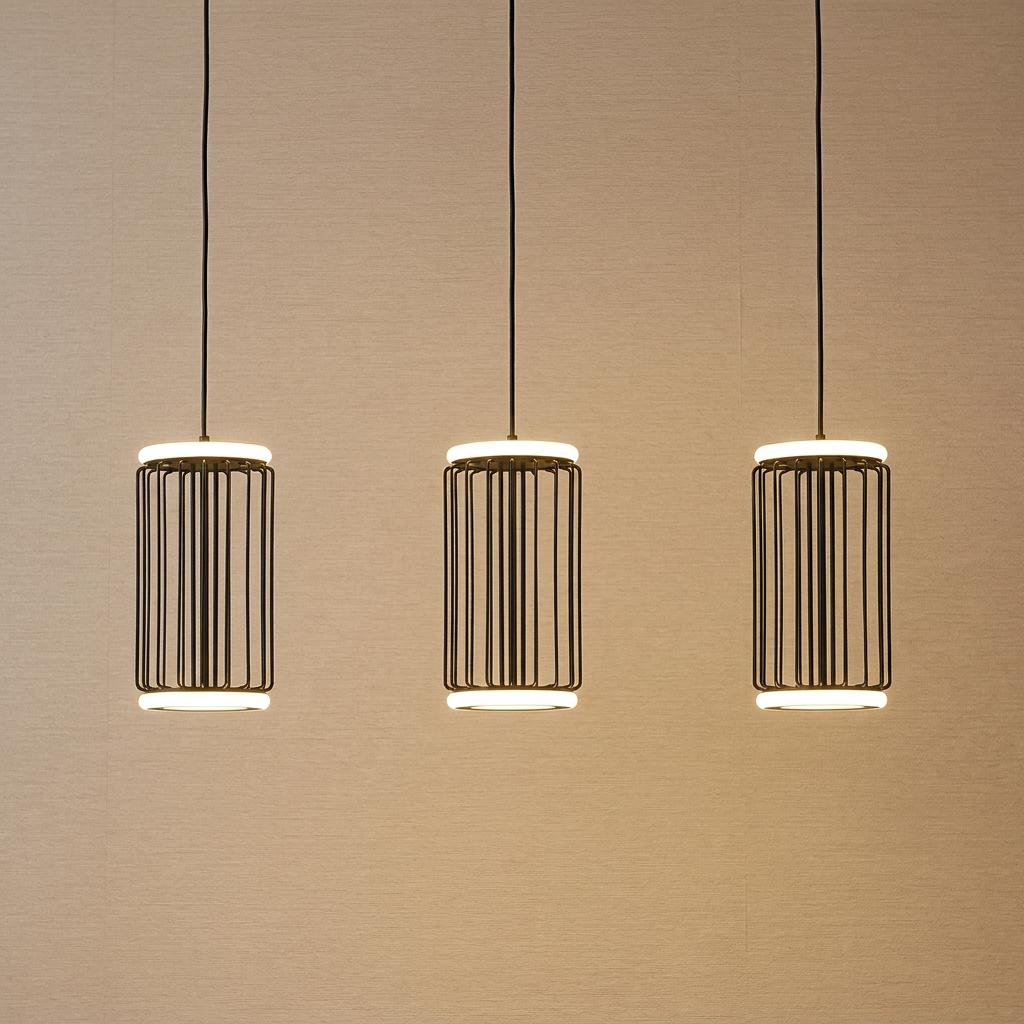 Three Circolo black LED cage bar pendant lights with glowing rings hanging against a neutral textured wall.