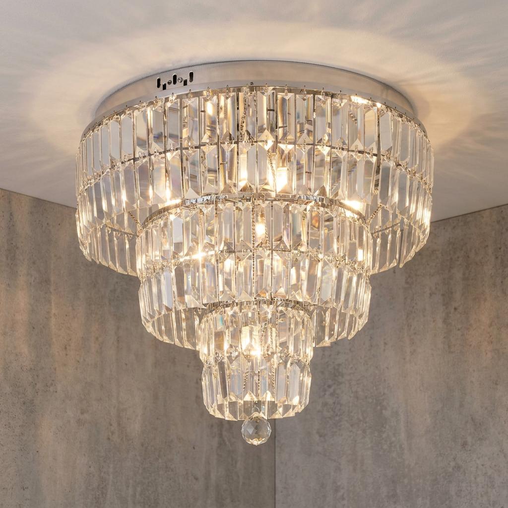 A three-tier chrome and crystal flush ceiling light with rectangular crystals and a warm glow.