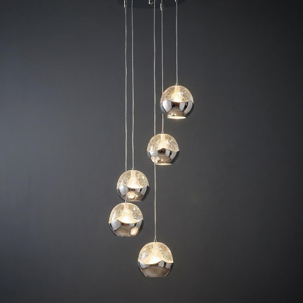 Modern five-light multi-drop pendant featuring chrome and textured glass globes hanging at varying heights.