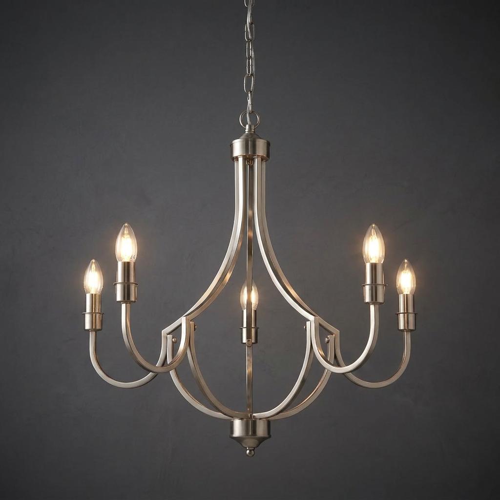Silver 5-light chandelier with elegant curved arms and lit candle bulbs against a dark grey textured wall.