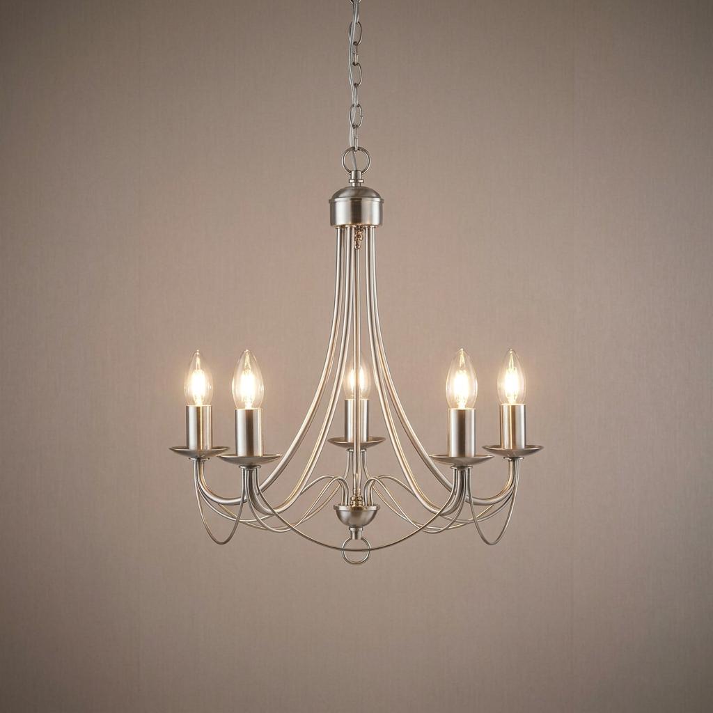 A five-light satin silver chandelier with curved arms and lit bulbs hanging against a neutral background.