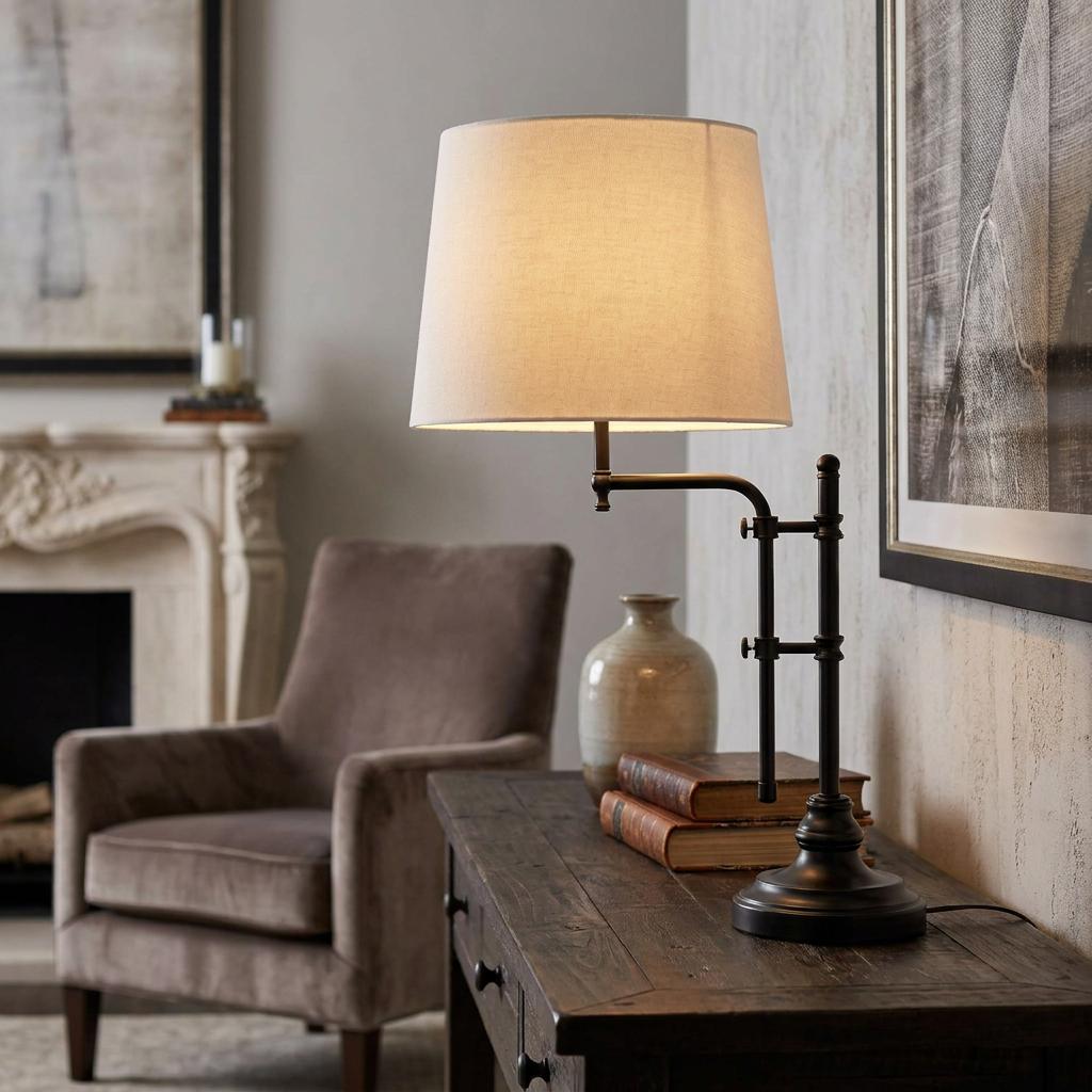Searchlight Munich black table lamp with a natural linen shade lit on a dark wood desk in a rustic living room.