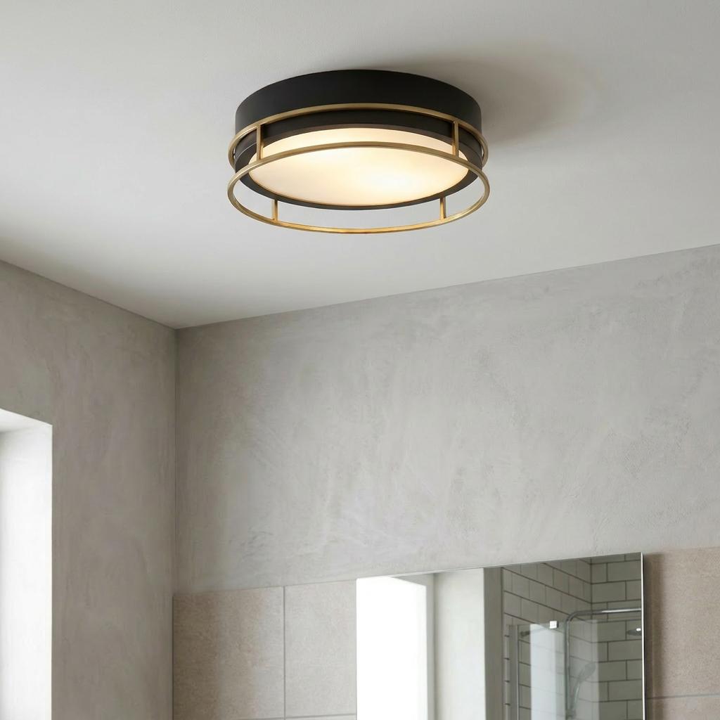 Searchlight Phoenix black and brass flush mount ceiling light with frosted glass diffuser in a modern bathroom.