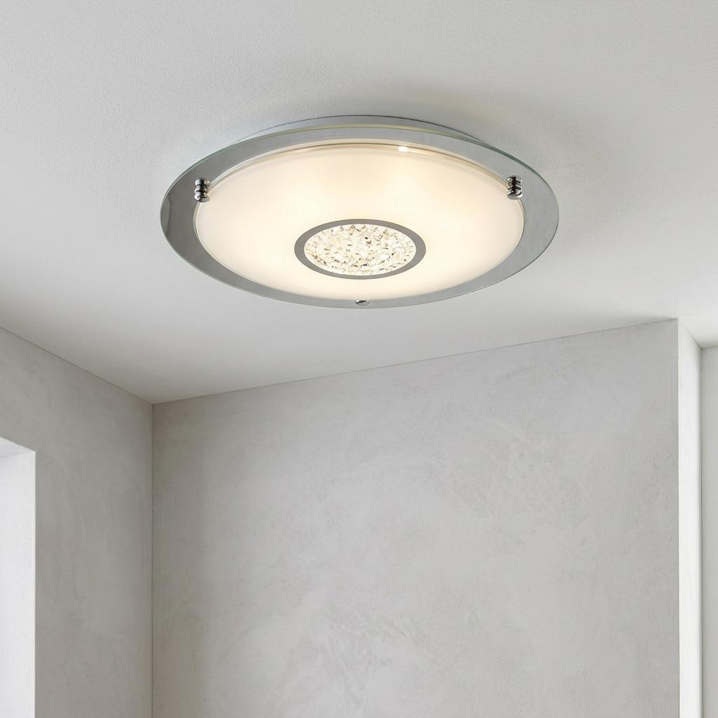 Round chrome LED bathroom flush light with a frosted diffuser and crystal detail mounted on a white ceiling.