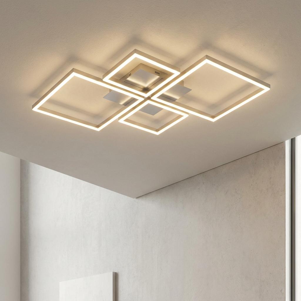 Modern silver four-light square LED flush mount ceiling fixture illuminating a white room.