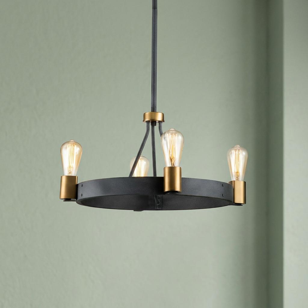 Silas 4-light pendant with a black circular frame, gold bulb holders, and Edison-style bulbs against a green wall.