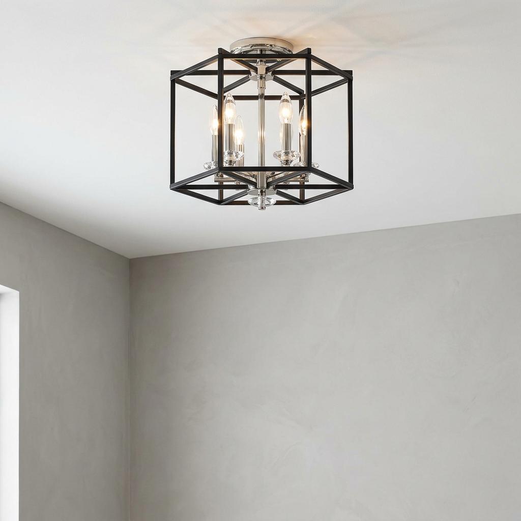 Modern black lantern semi-flush ceiling light with nickel accents and four lit candles.
