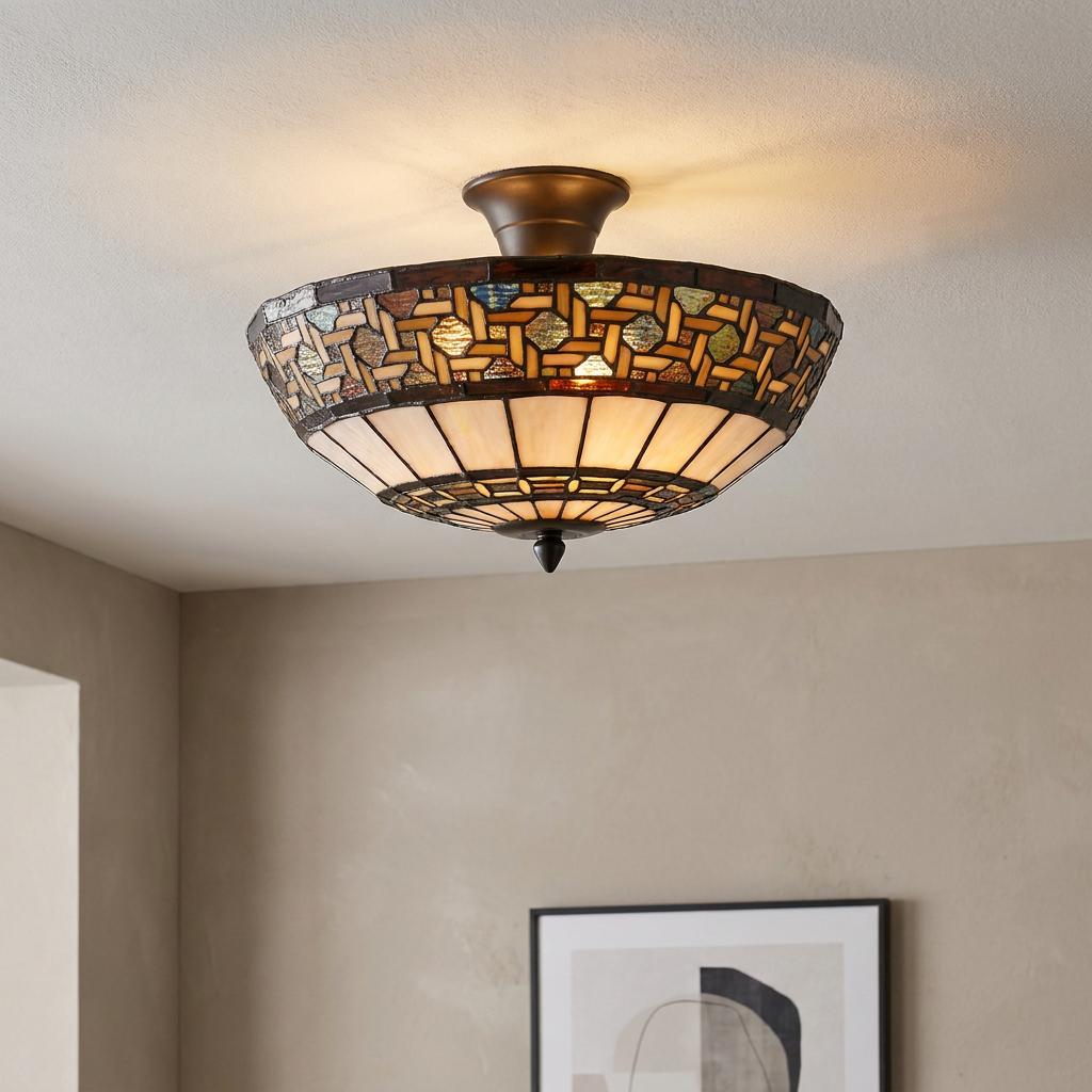 Stretford Tiffany semi-flush ceiling light with an intricate earth-tone stained glass mosaic shade on a white ceiling.