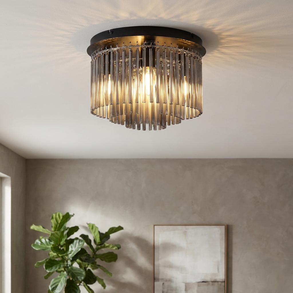 Swizzle matt black flush ceiling light with tiered smoked glass rods, casting warm light patterns in a modern room.