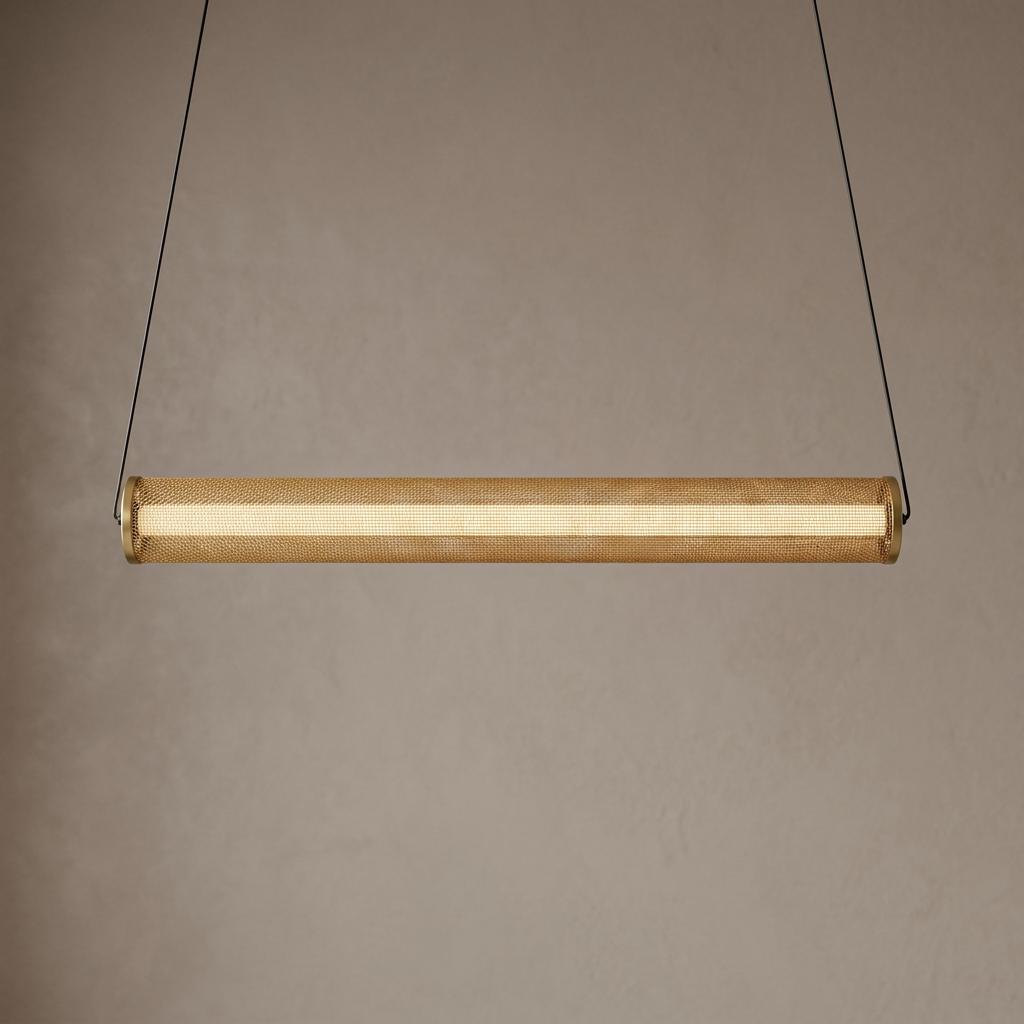 A horizontal cylindrical pendant light with a gold mesh screen and internal LED strip against a neutral wall.