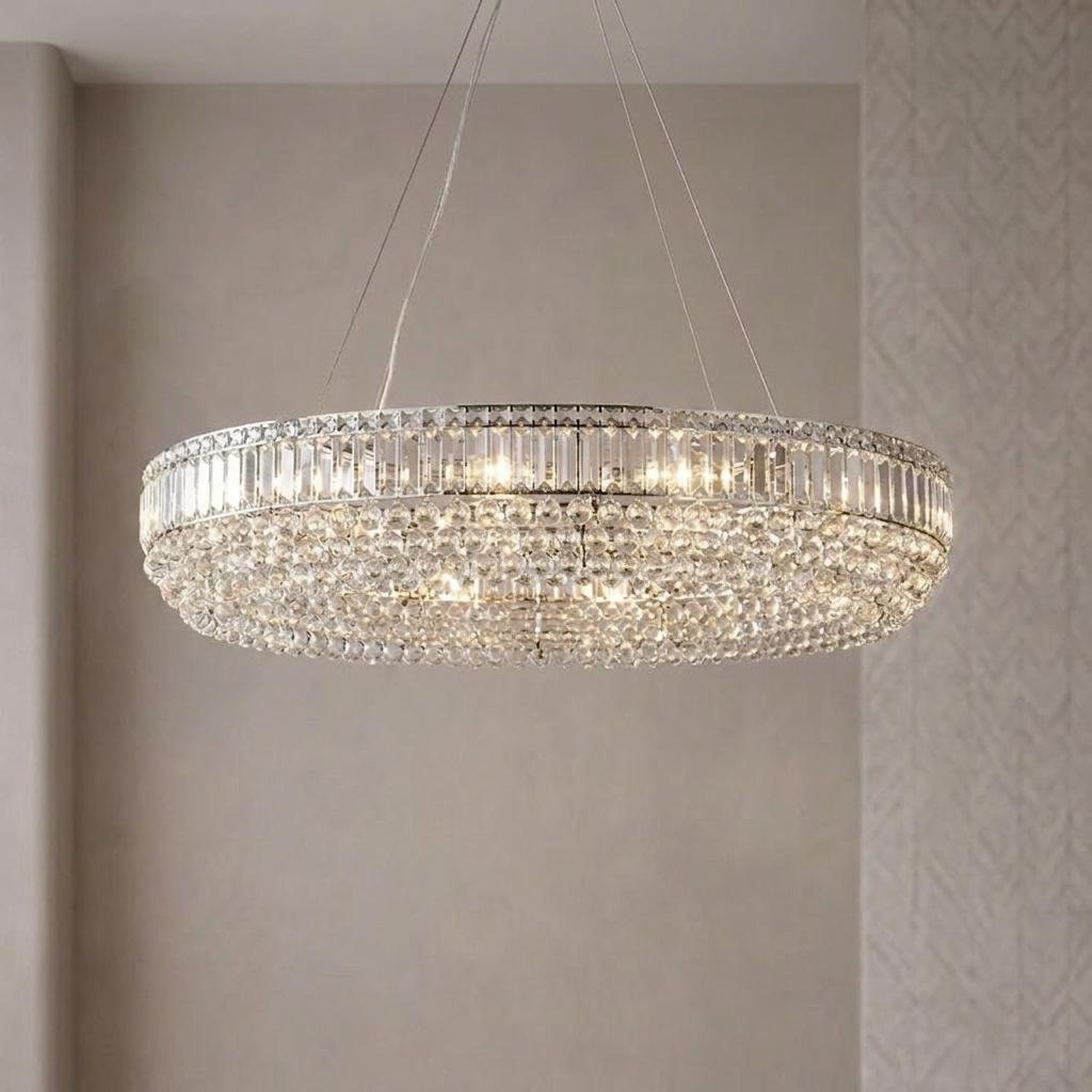 Glowing Vesuvius oval chrome chandelier with shimmering clear crystal droplets and bars.