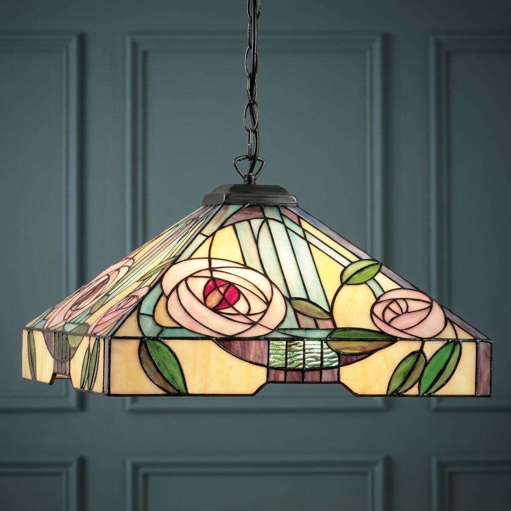 Tiffany style pendant light with pink rose stained glass shade hanging against a dark paneled wall.