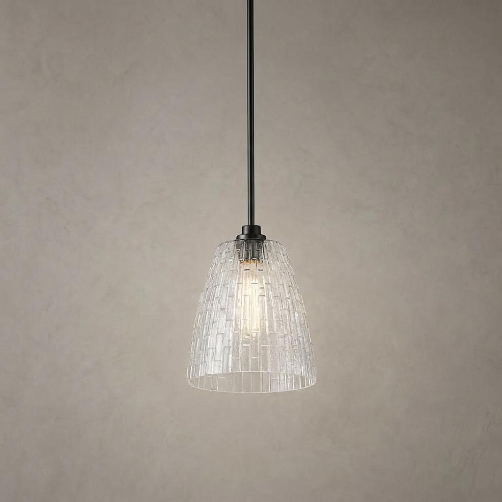 Windsor industrial pendant light with a textured blown glass shade and black rod hanging against a neutral wall.