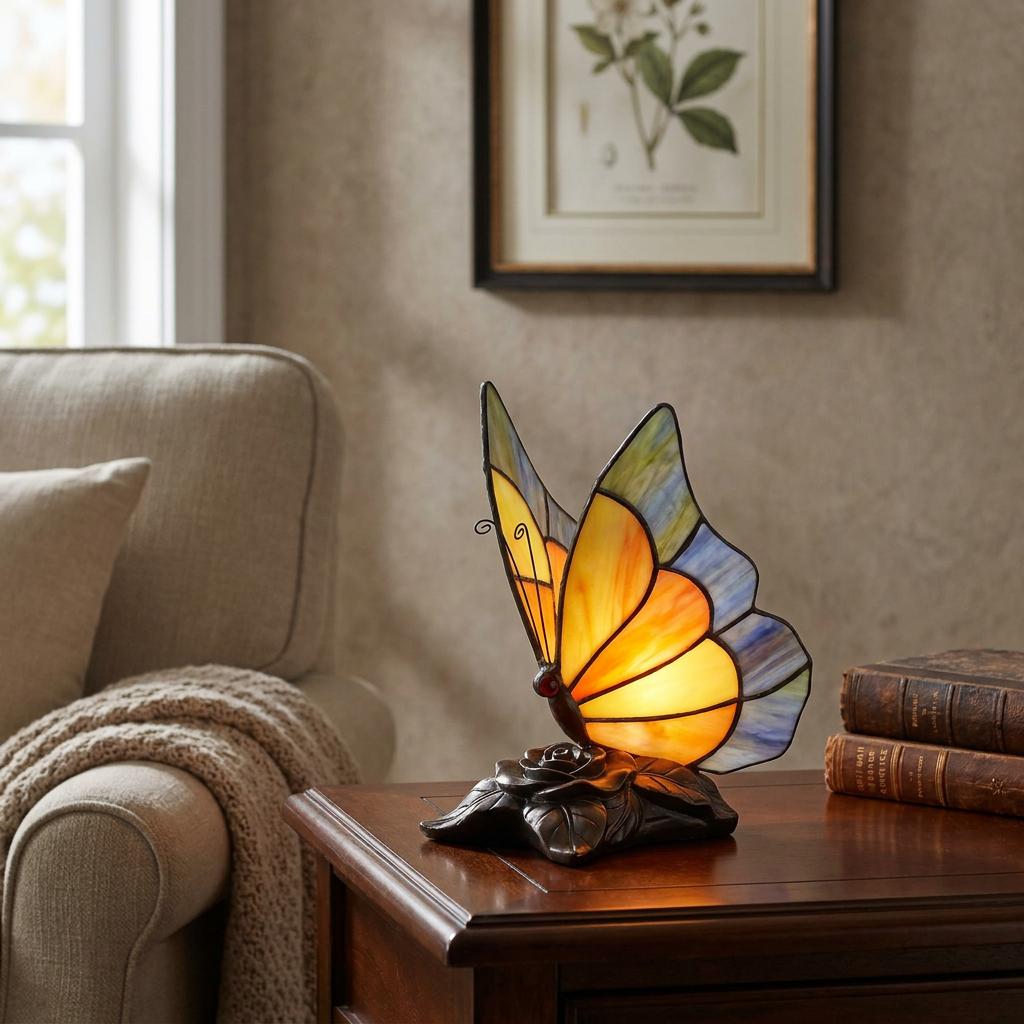 Stained glass butterfly lamp with glowing yellow wings on a wooden side table in a cozy living room setting.