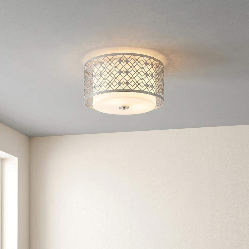 Ziggy lacquered silver flush ceiling light with a geometric lattice frame and white shade on a grey ceiling.