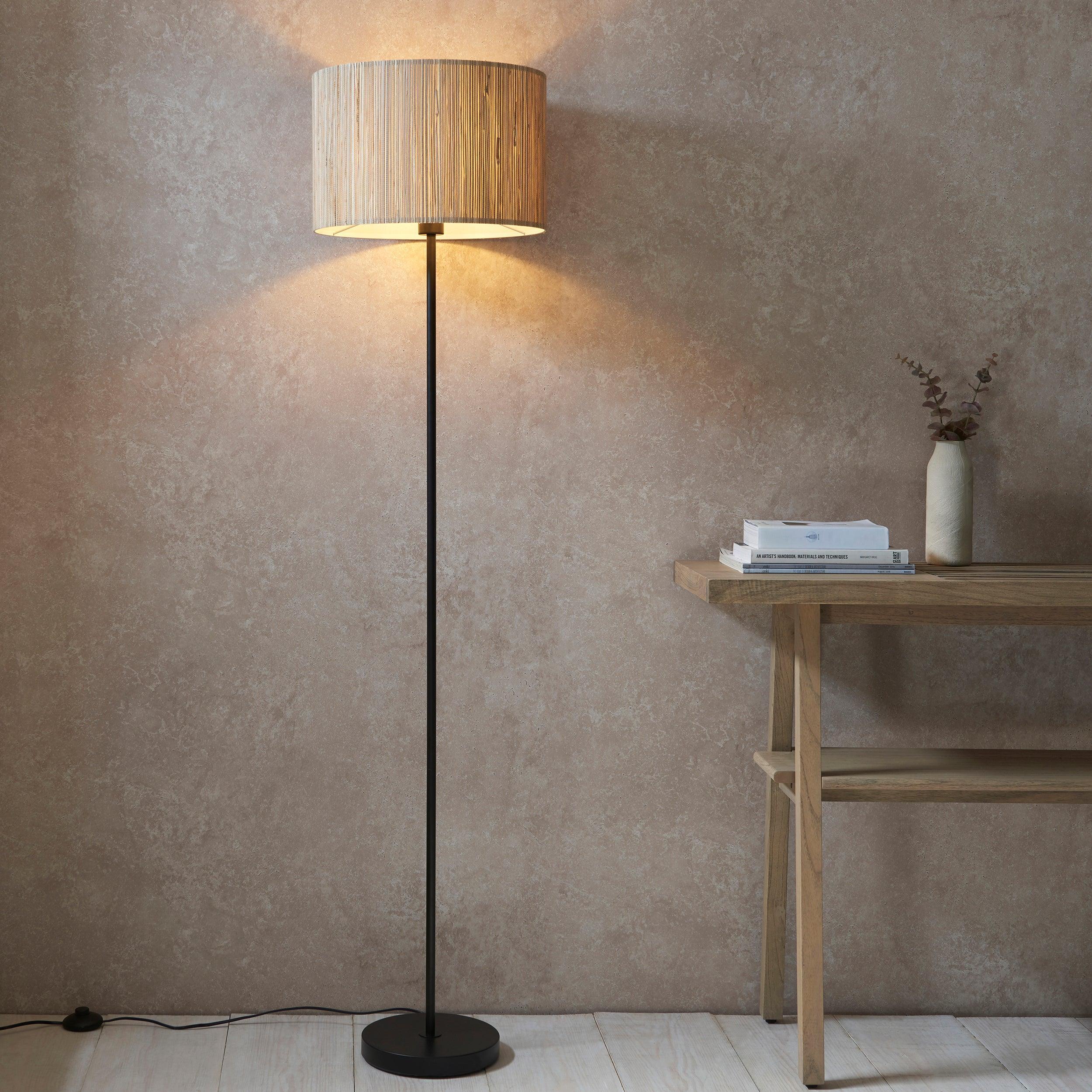 longshore black floor lamp with seagrass shade by Endon Lighting Living room close up image