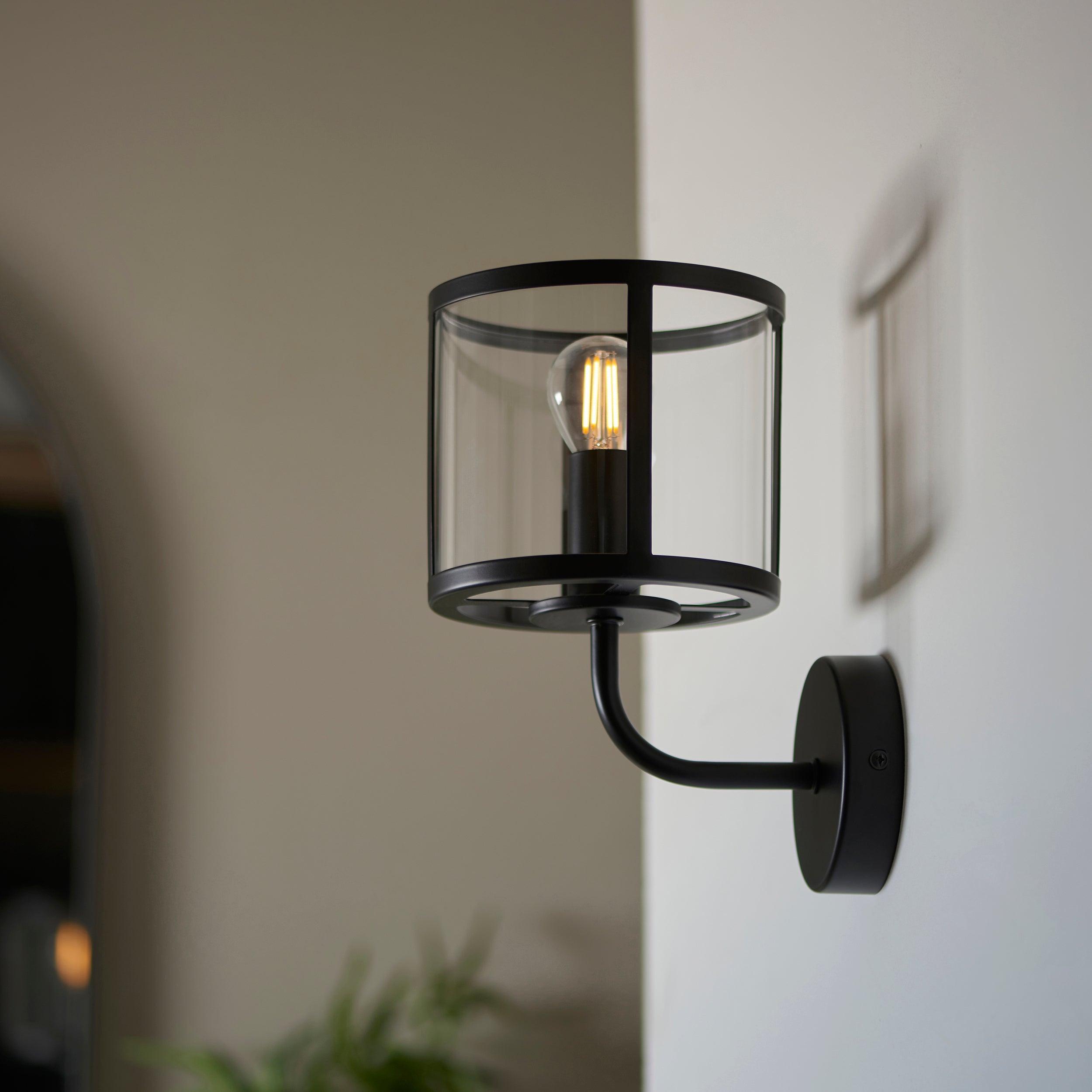 hopton black wall light clear glass shade by Endon Lighting Living Room Family Shot