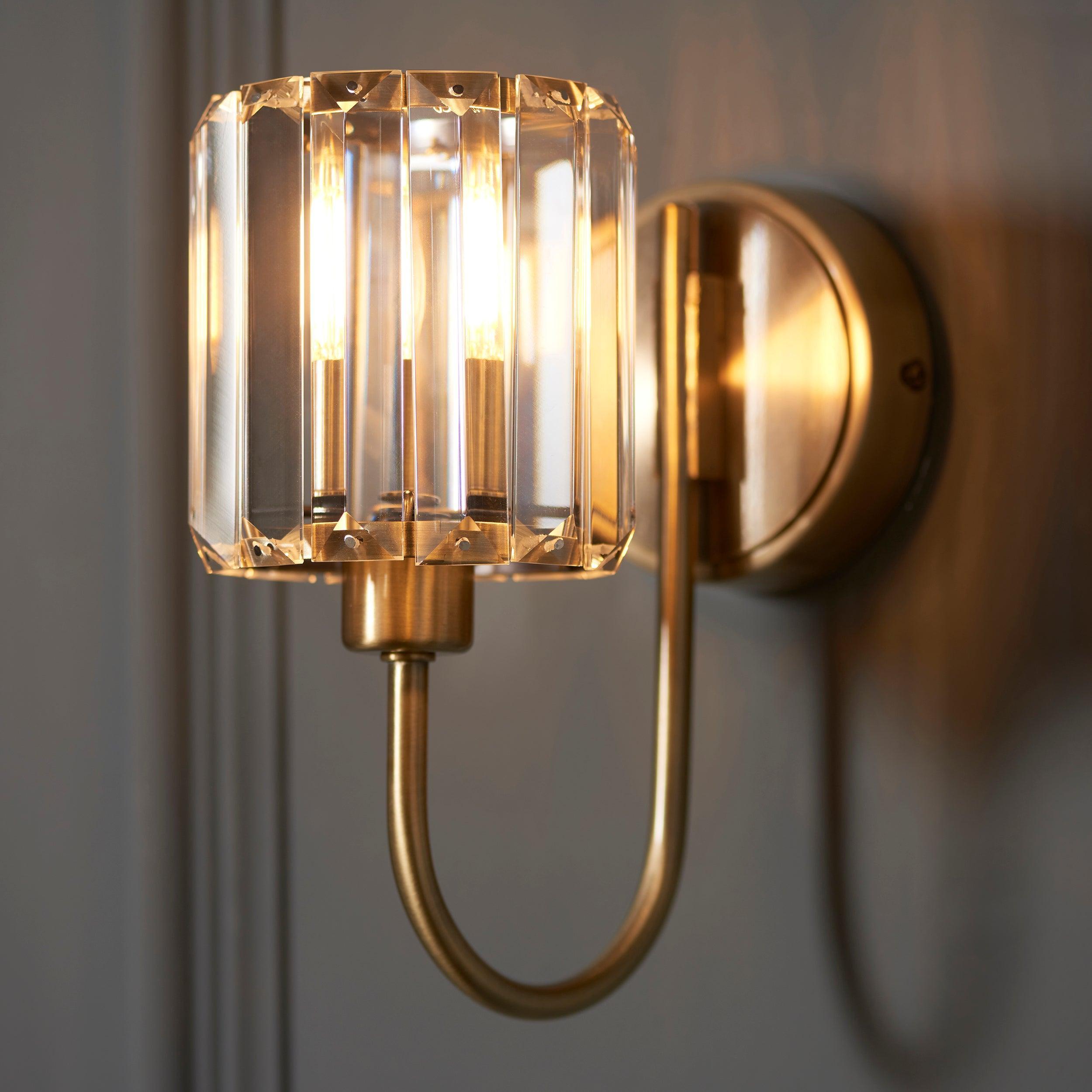 berenice brass wall light clear cut glass shade by Endon Lighting Bedroom Close Up Image