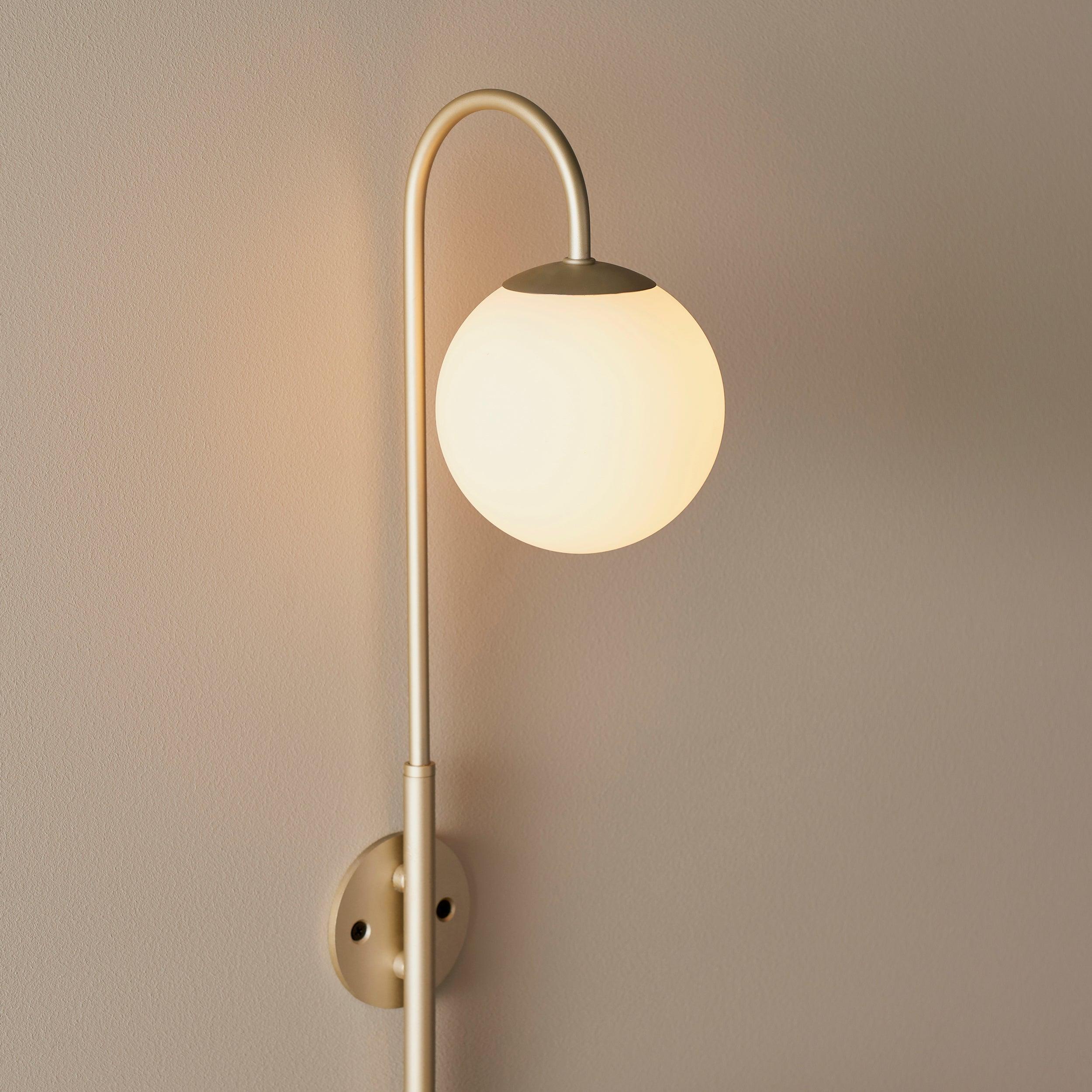 southall plug in champagne wall light with opal glass shade Close Up Lit Image