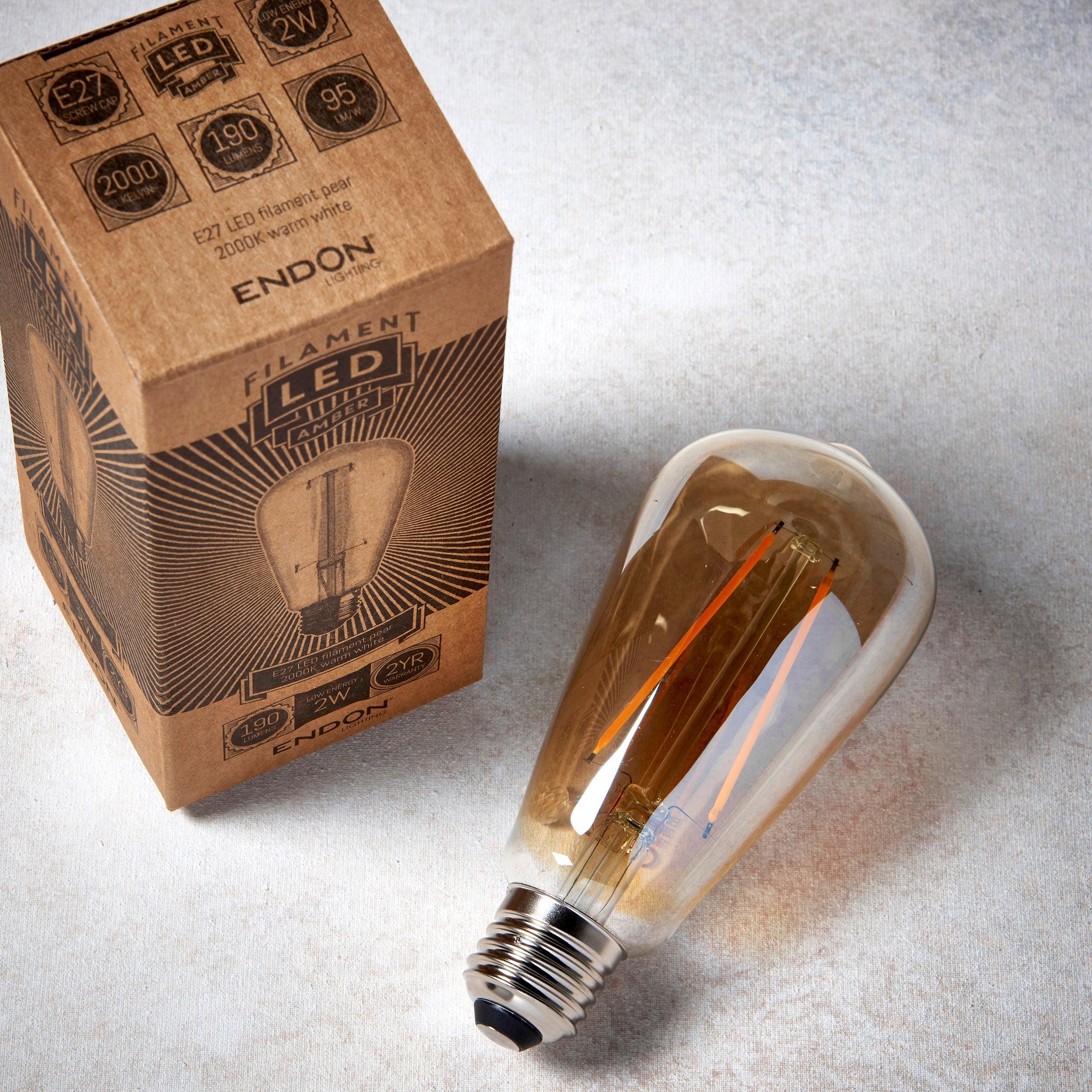 e27 led 2w decorative filament amber pear light bulb Close Up Lit Image