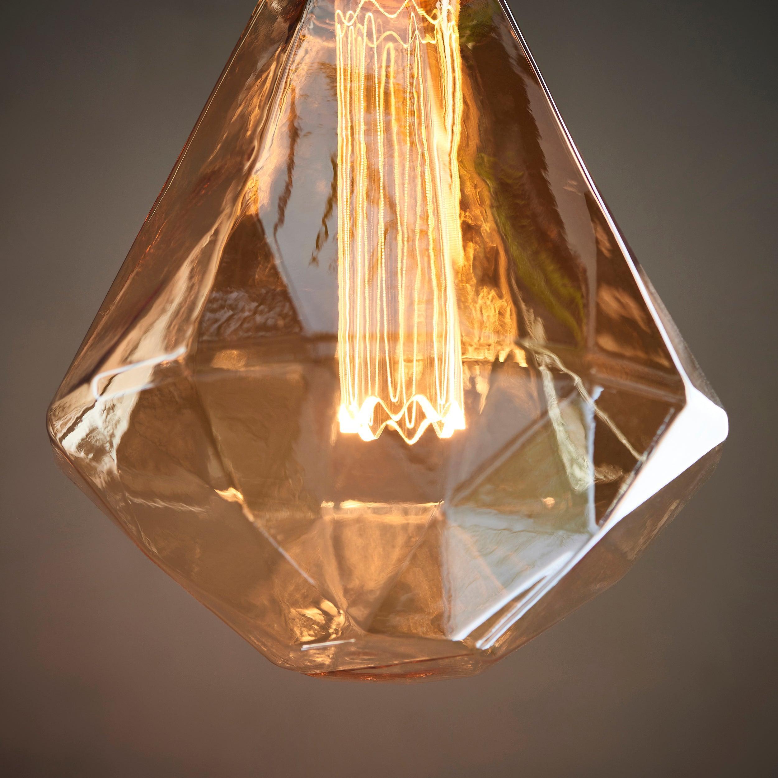 faceted amber tinted decorative 2 4w led e27 light bulb Close Up Lit Image